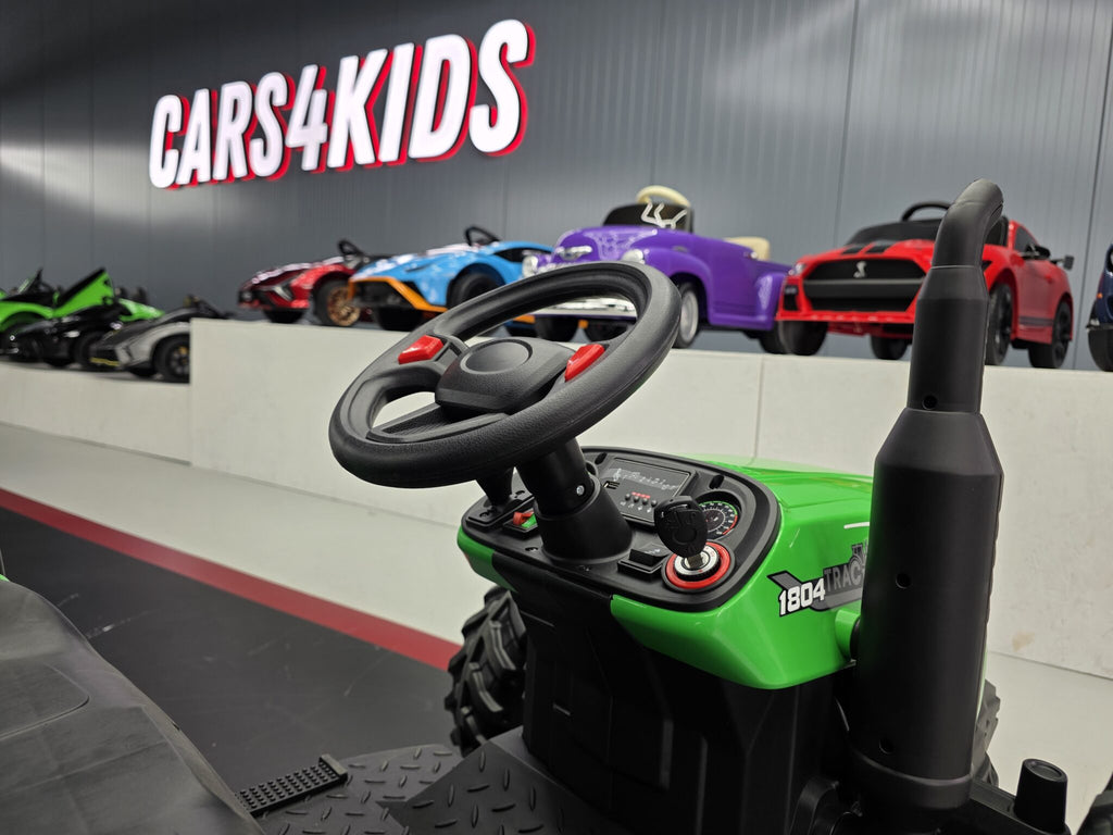 Additional view of the green 24V kids electric tractor with trailer