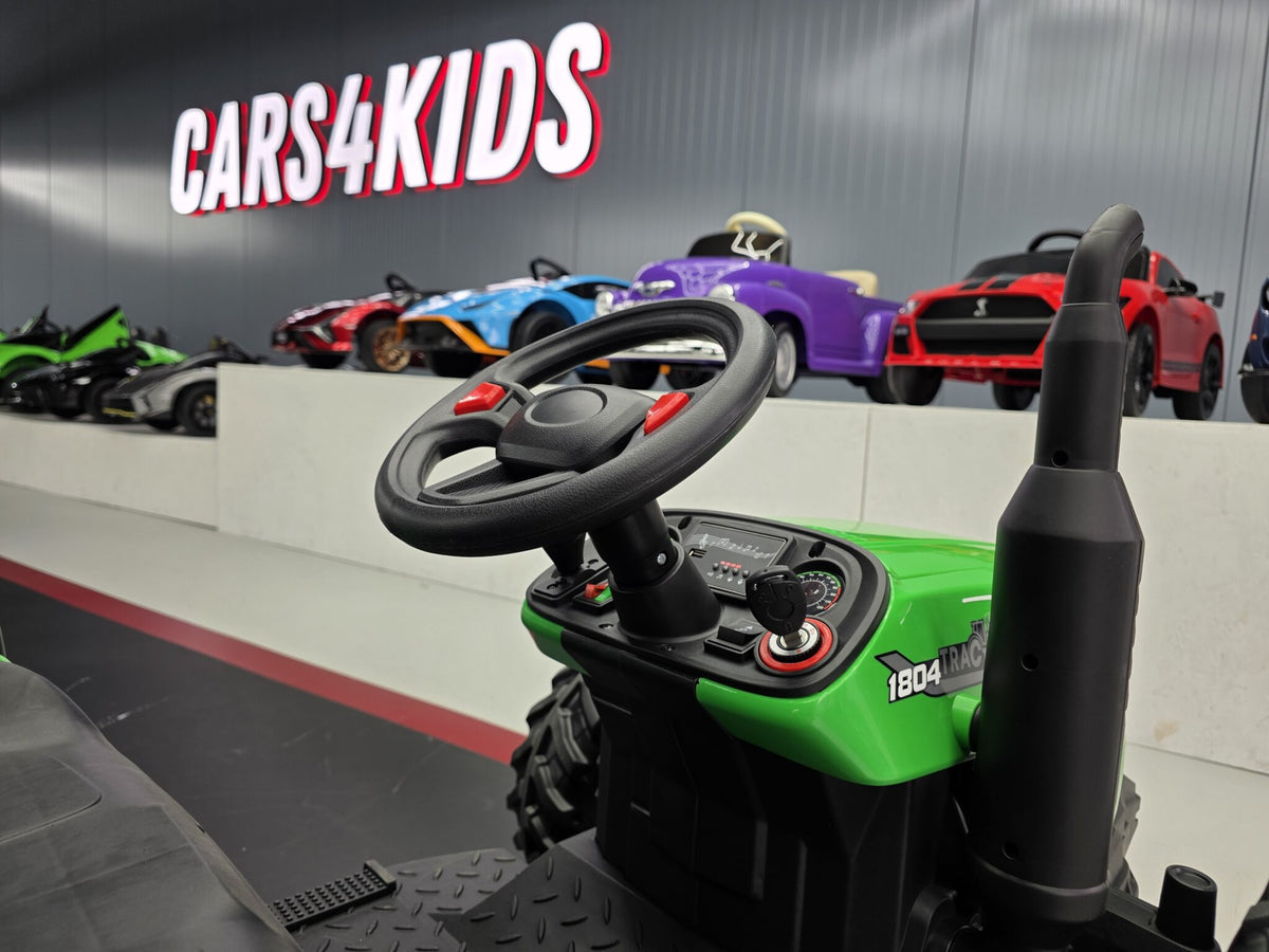 Additional view of the green 24V kids electric tractor with trailer