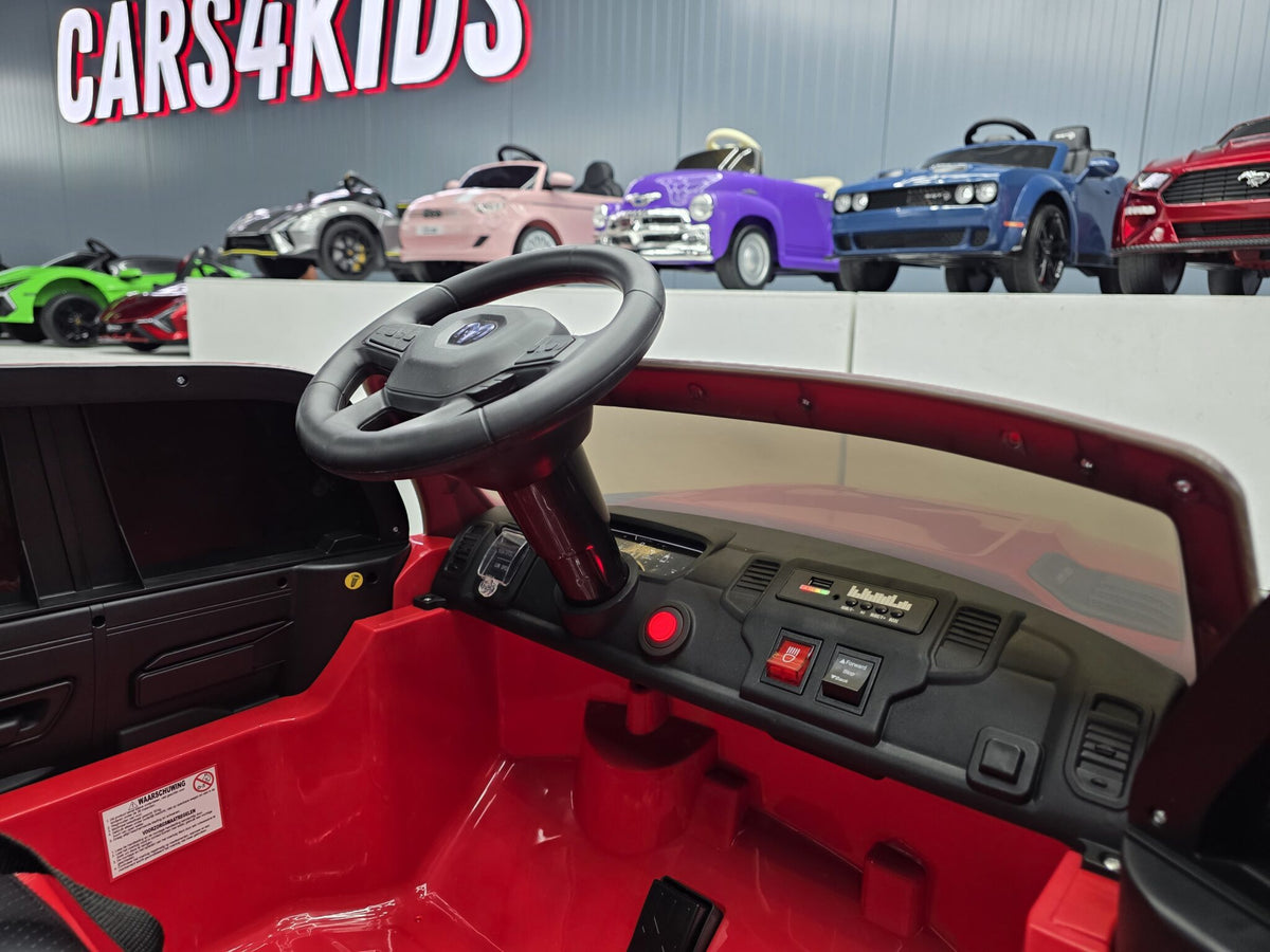 Additional view of the red 12V Dodge RAM-inspired kids electric ride-on car